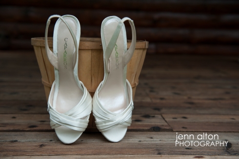 Bride's shoes detail, with apple bucket and wood porch