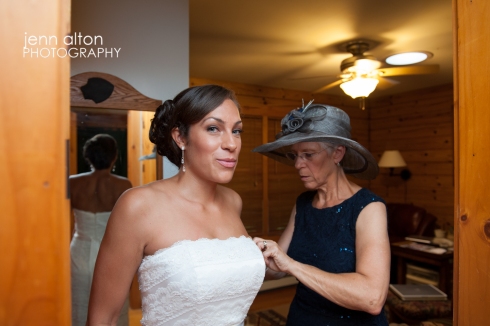 Bride getting into wedding gown with the help of her Mother, Cape Cod Wedding