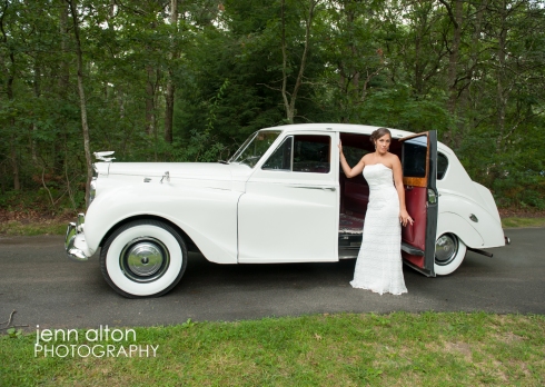 Bride posing with Rolls Royce before wedding, Cape Cod
