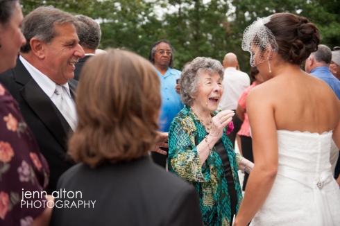 Bride accepting congrats from family and friends after ceremony, Cape Cod Wedding, Mashpee Old Indian Meeting House 