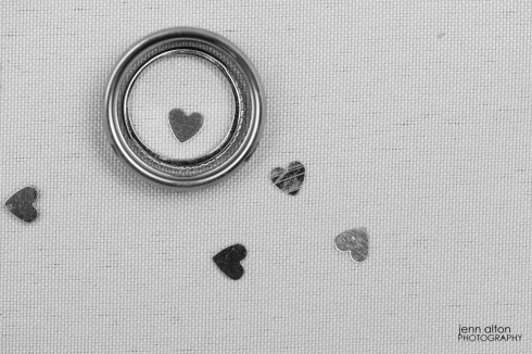 Wedding bands and heart confetti.