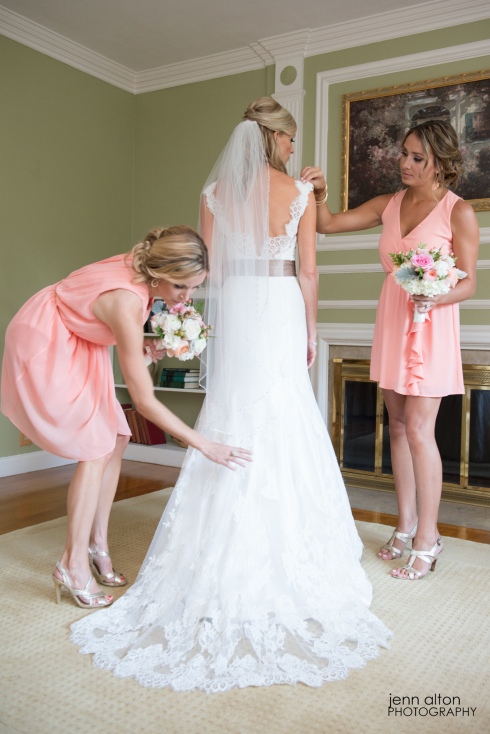 Final touches on dress with bride and maid of honors, Henderson House